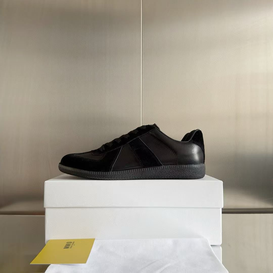 ua ma*s*n Ma*i*la mm6 sneakers