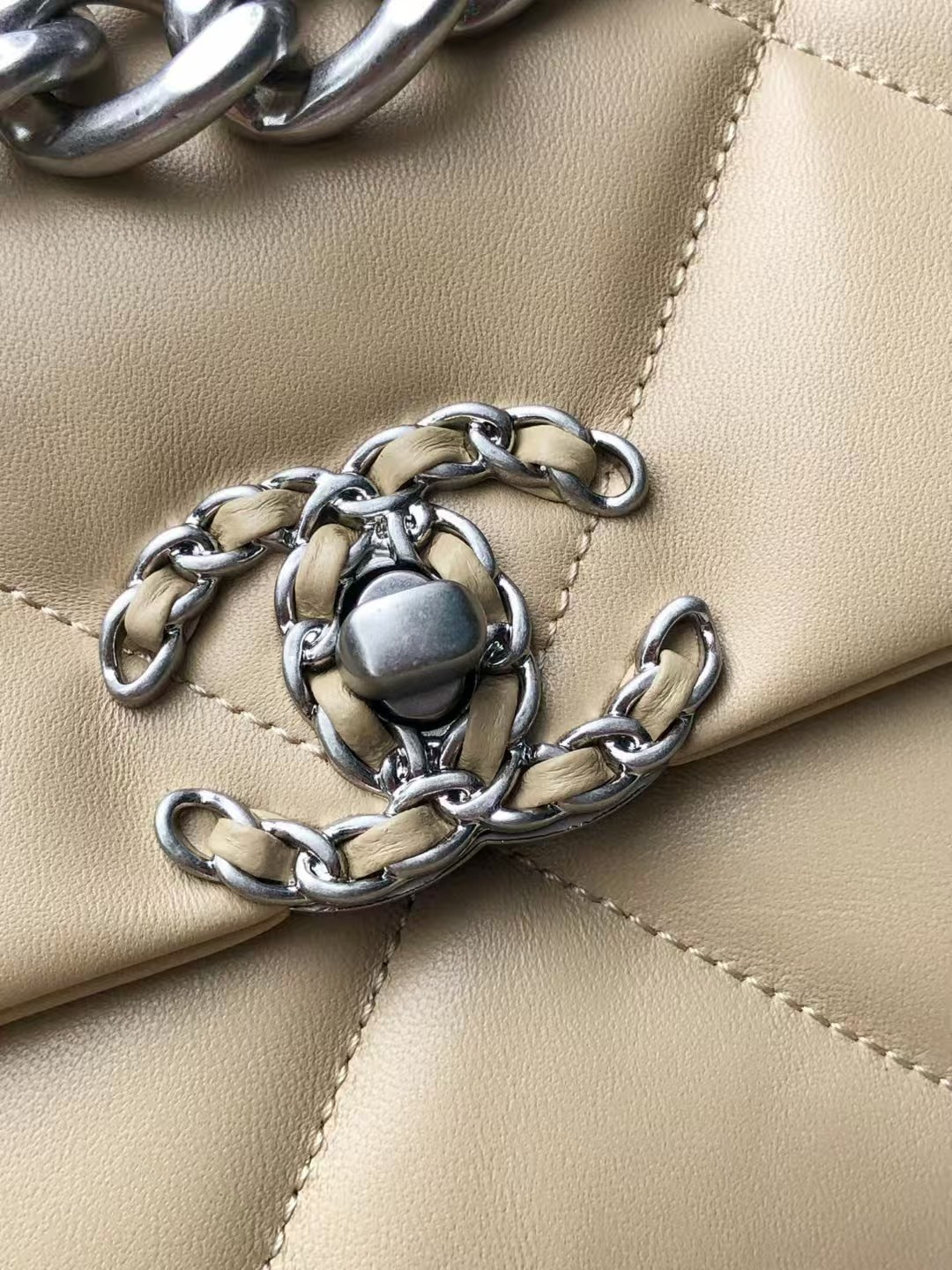 Ch*el 19 handbag shiny leather, gold-tone, silver-tone & ruthenium-finish metal beige 26x16x9cm