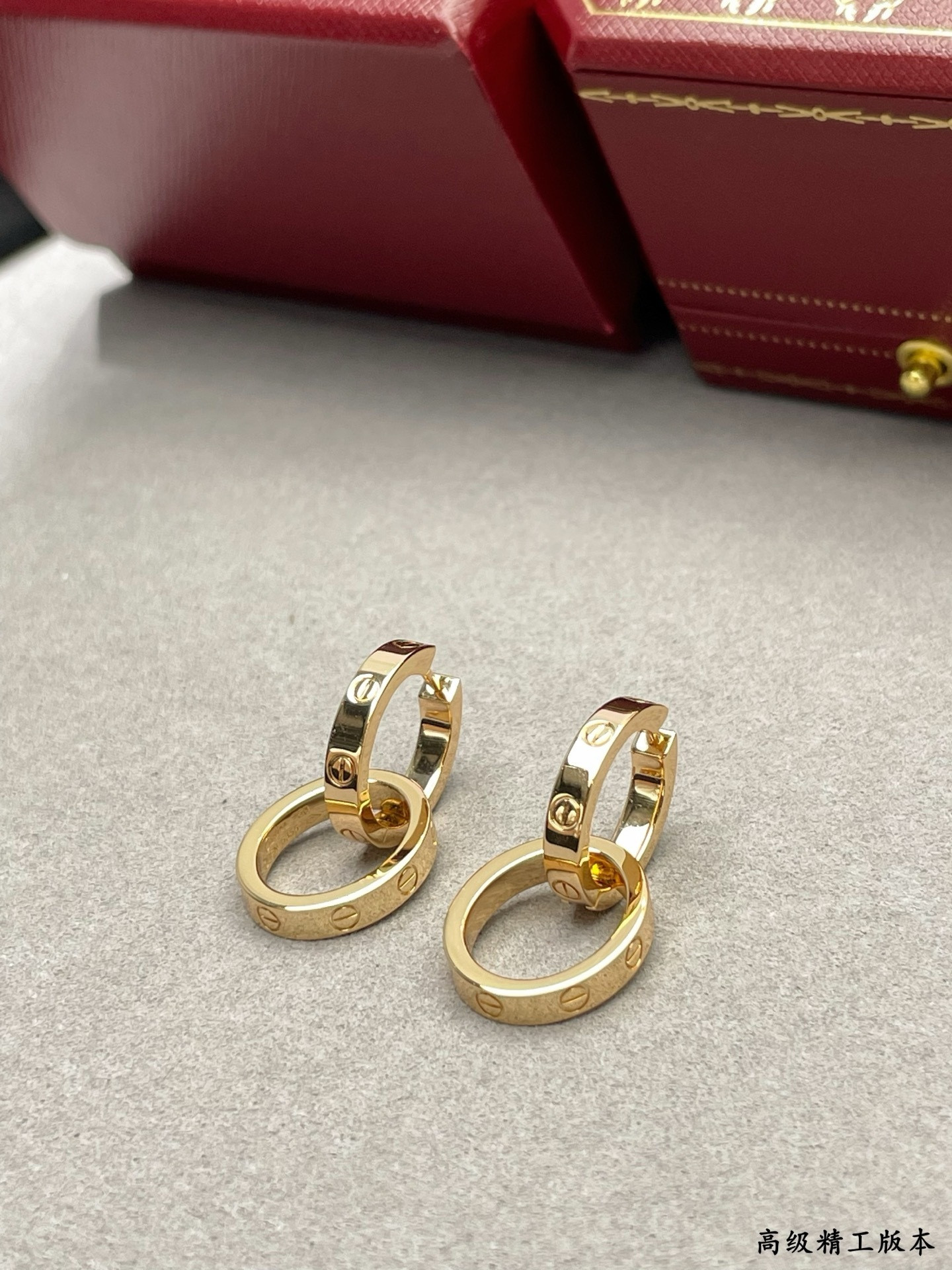 Ca*t*er double ring polished earrings