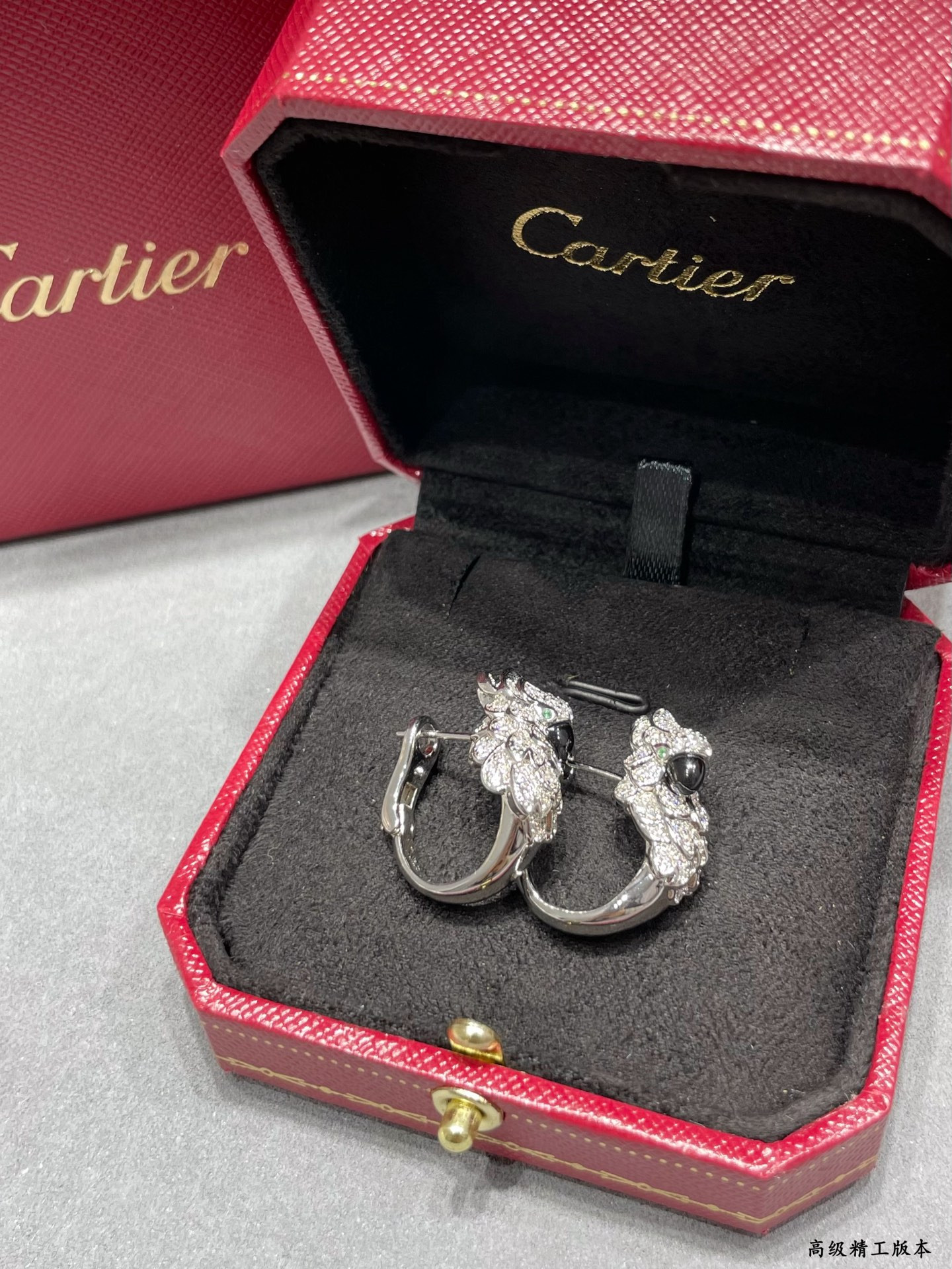 Ca*t*er parrot earrings