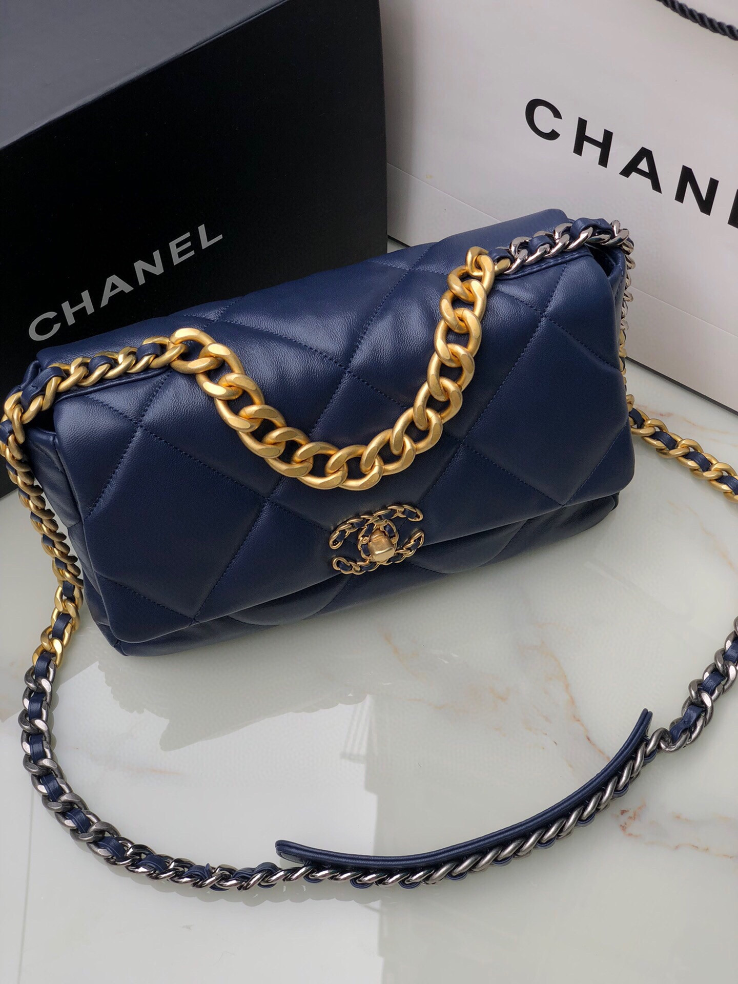 Ch*el 19 large handbag shiny leather, gold-tone, silver-tone & ruthenium-finish metal navy 7.8 × 11.7 × 3.9 in
