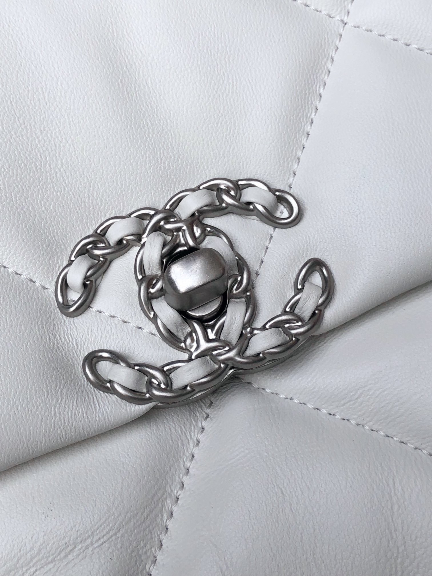 Ch*el 19 handbag shiny leather, gold-tone, silver-tone & ruthenium-finish metal white 6.2 × 10.1 × 3.5 in