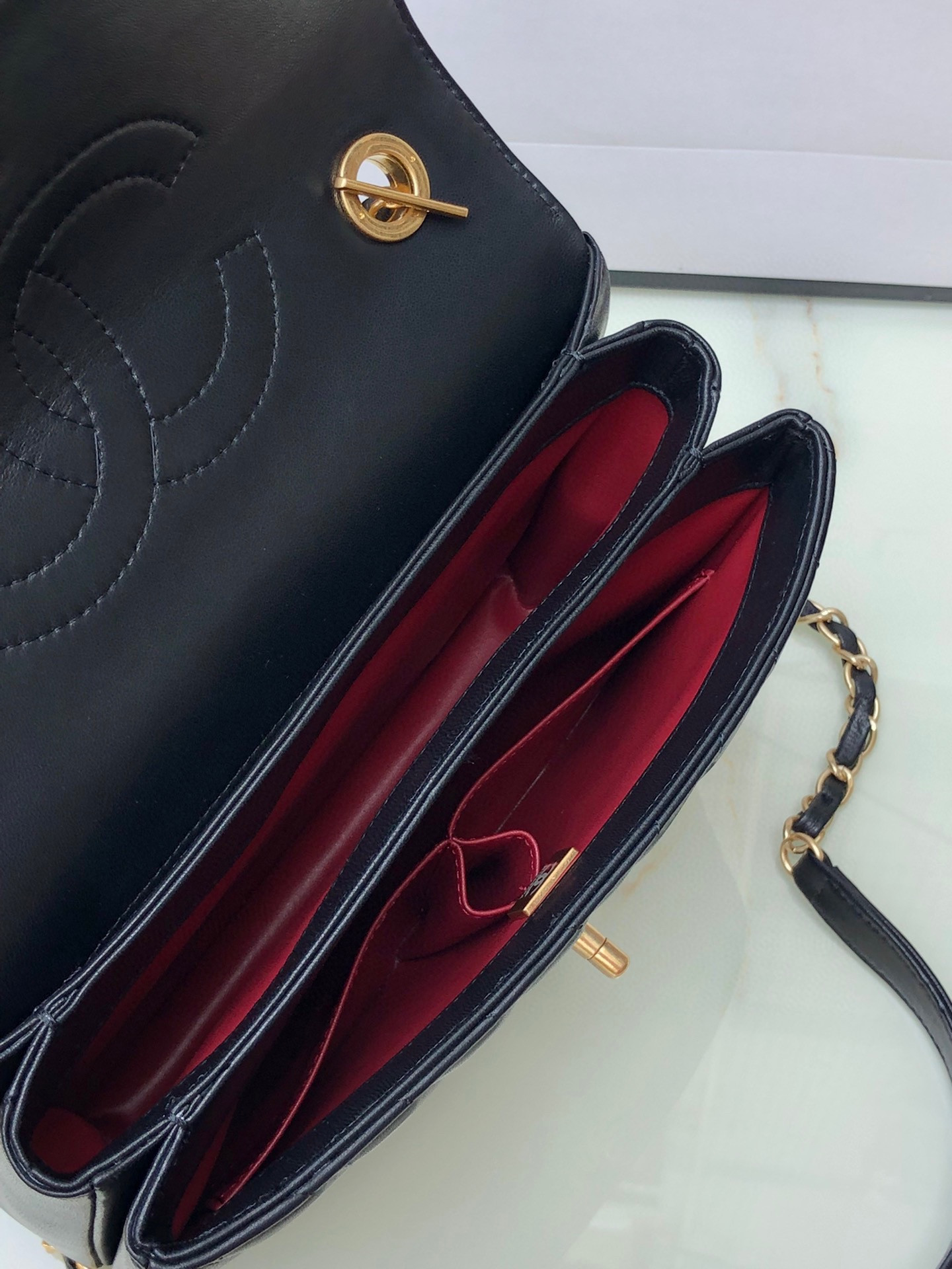 Ch*el flap bag with top handle 6.6 × 9.8 × 4.7 in