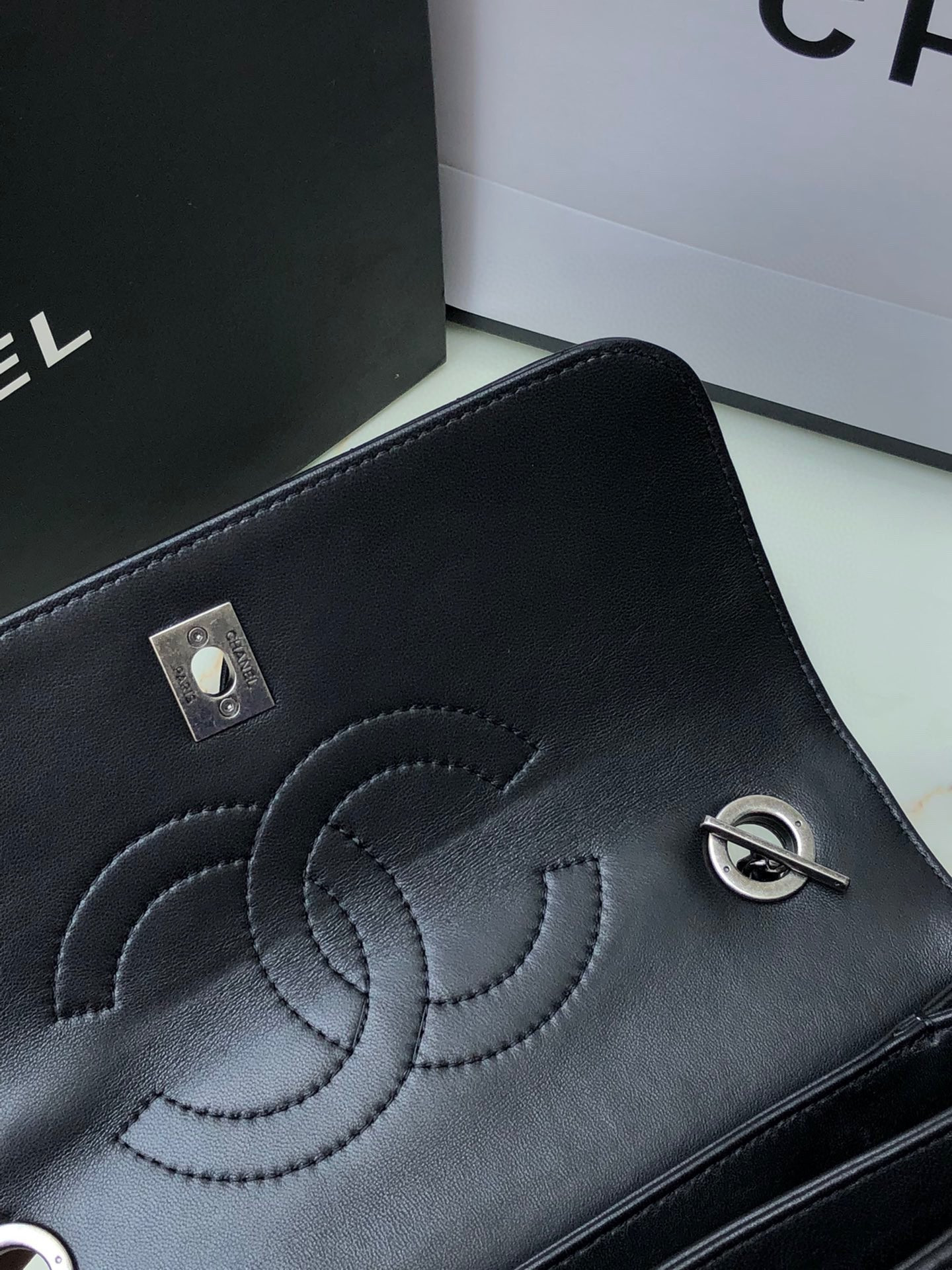Ch*el flap bag with top handle 6.6 × 9.8 × 4.7 in