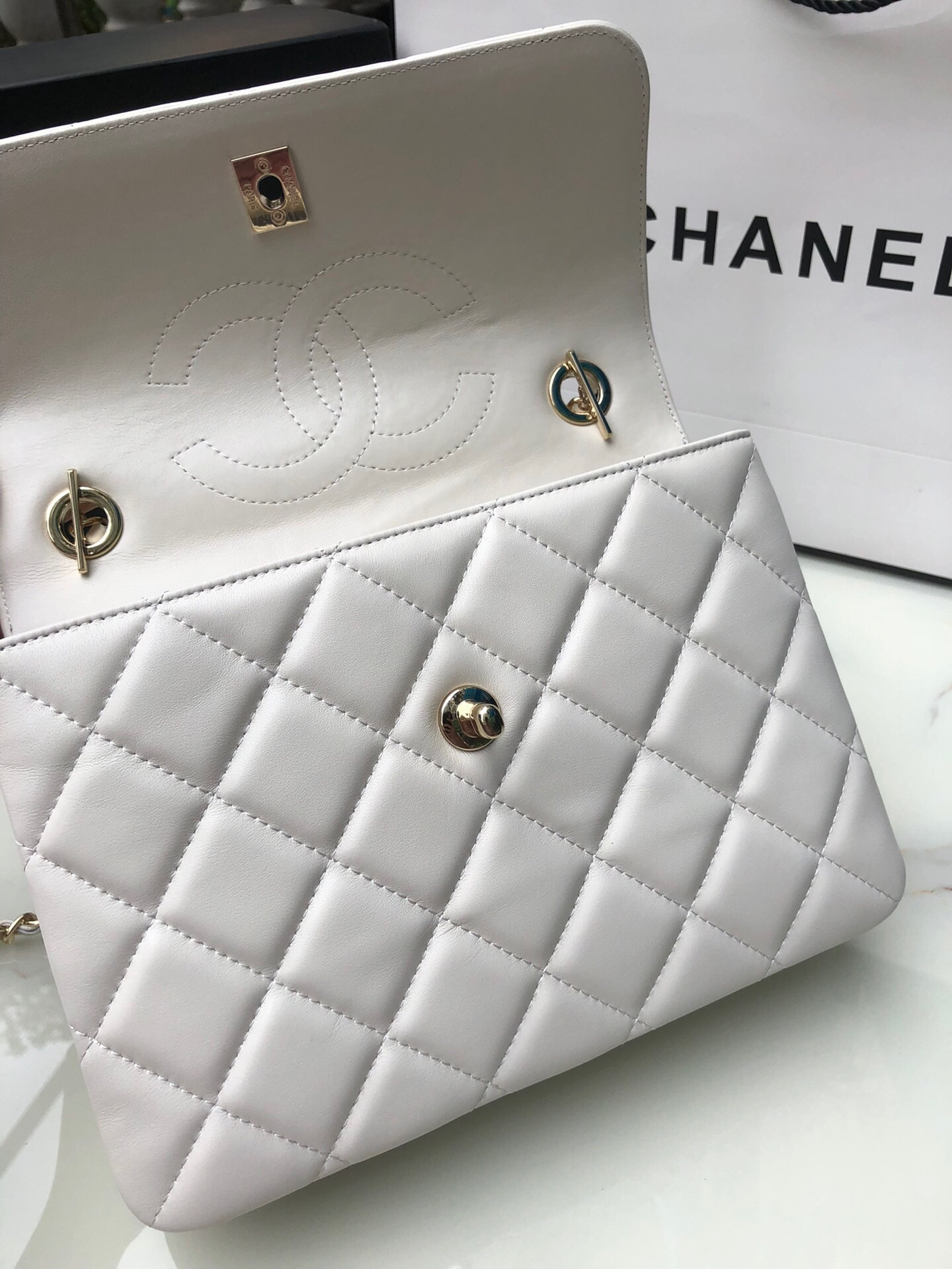 Ch*el flap bag with top handle 6.6 × 9.8 × 4.7 in