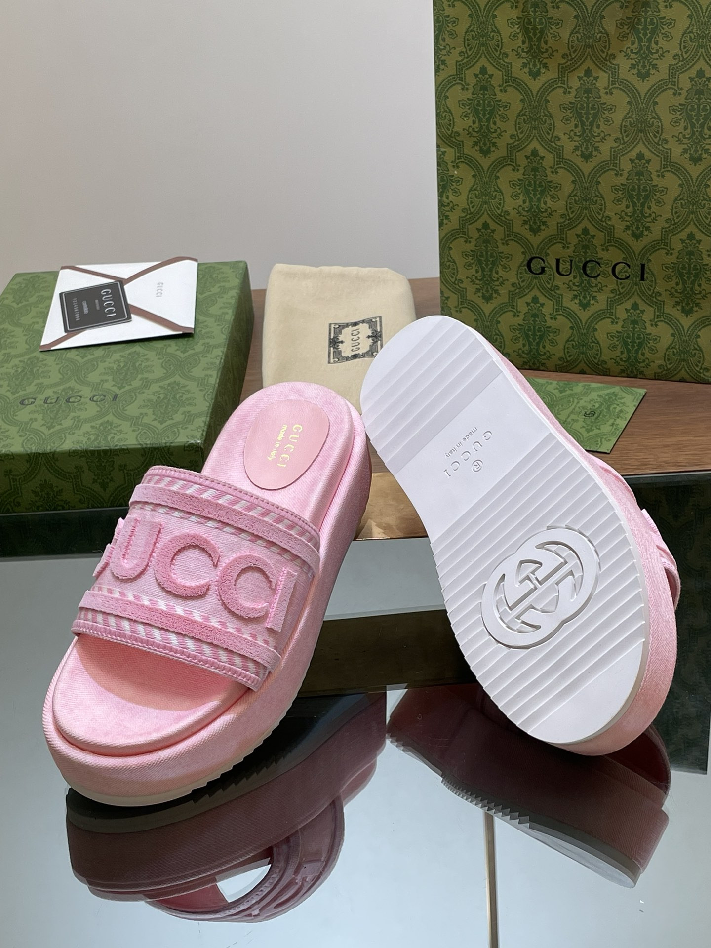 ua G*u*i slide sandal with G*u*i script