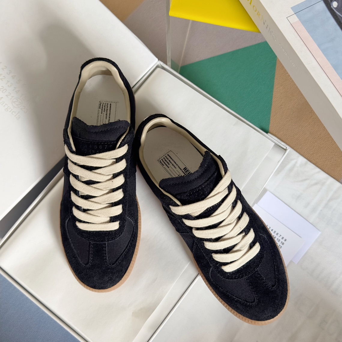 ua ma*s*n Ma*i*la mm6 sneakers